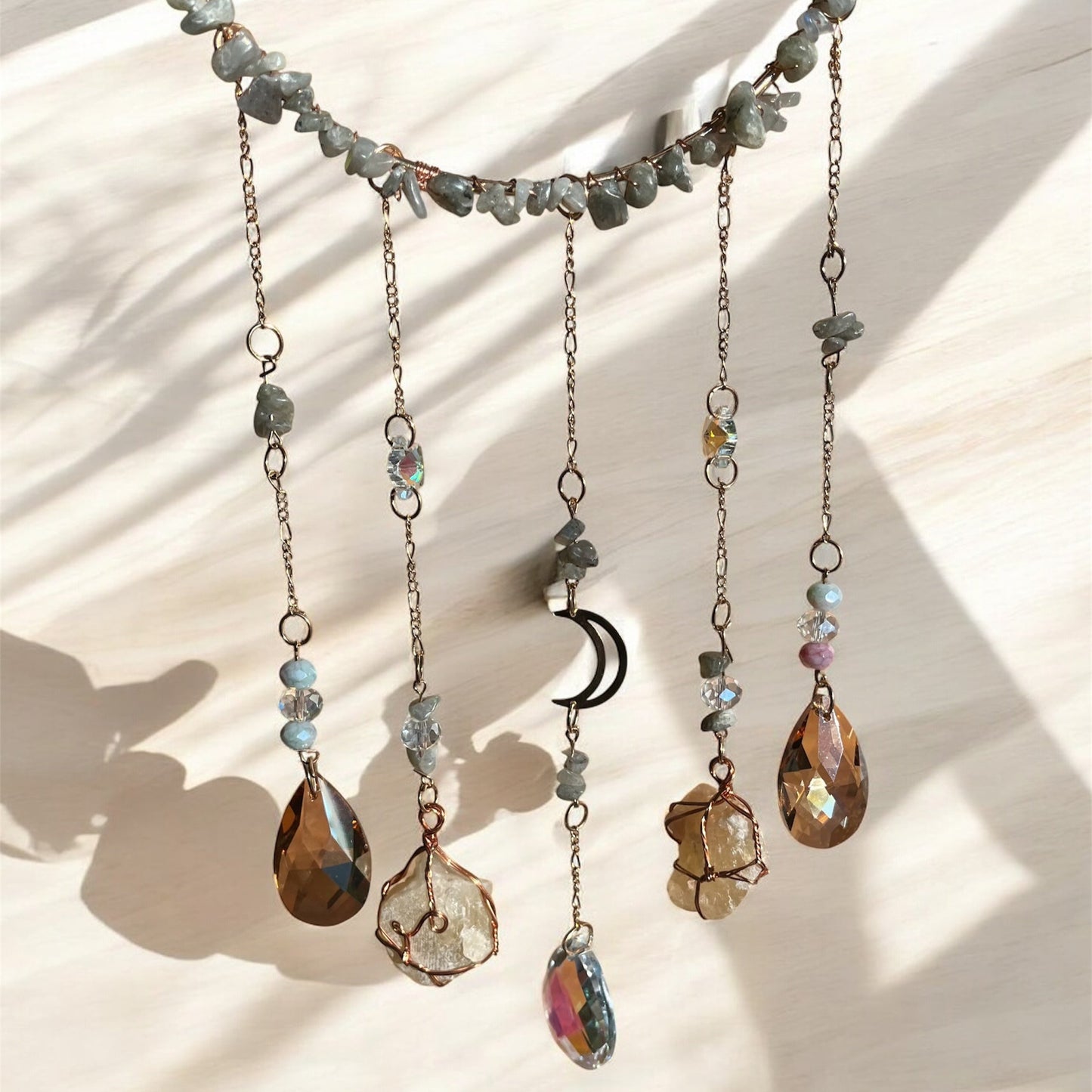 Necklace with various beads and stones on a light background