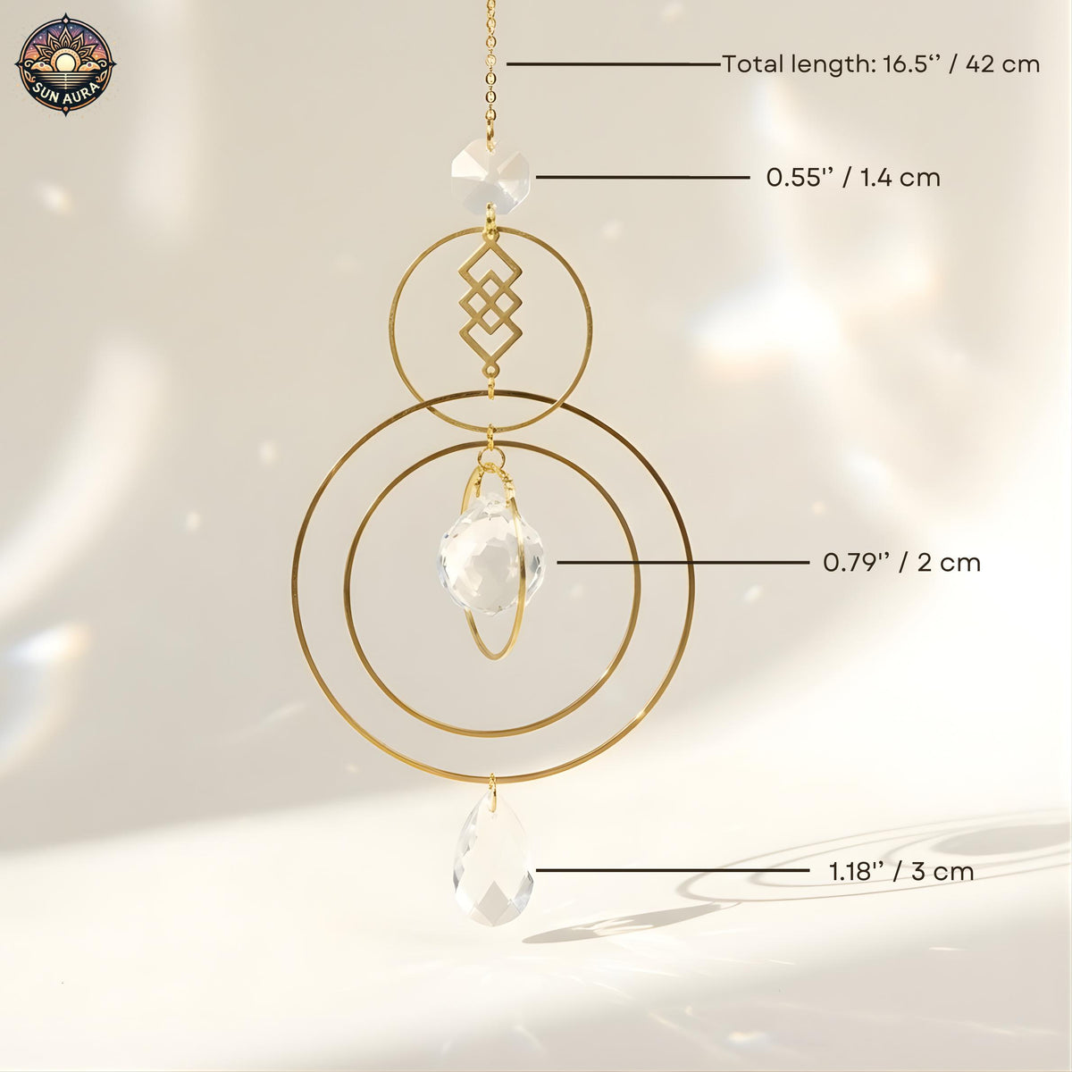Gold circular hanging ornament with measurements on a light background