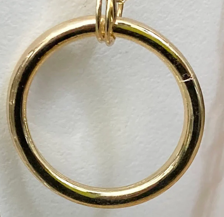 Gold ring pendant on a white background