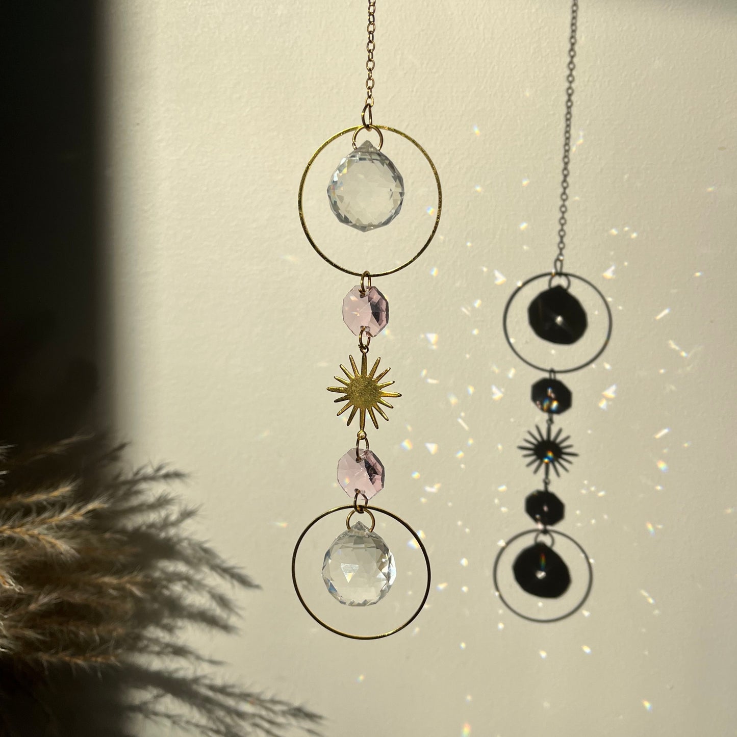 Pink Suncatcher with decorative elements on a textured surface