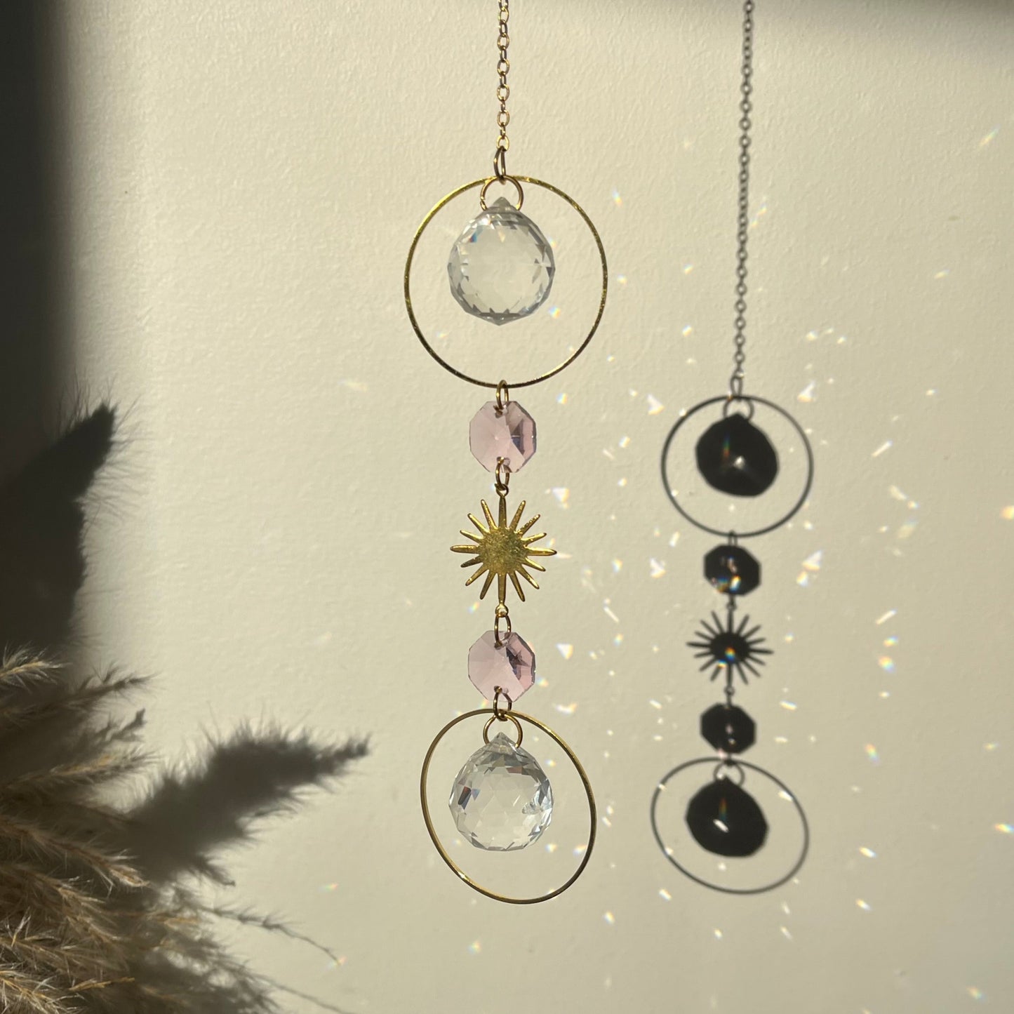Decorative hanging with crystals and metallic elements on a light background