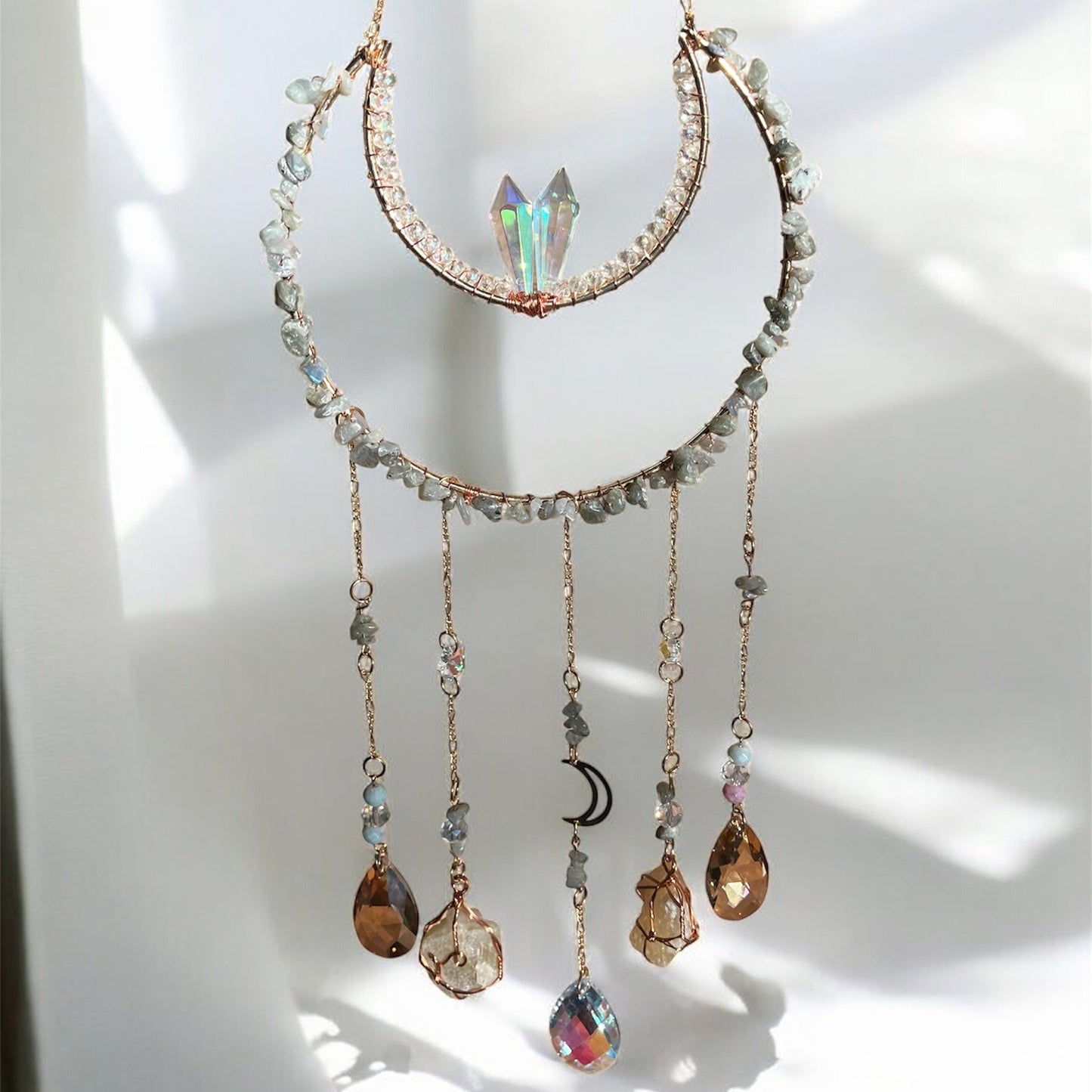 Suncatcher with crystal pendants on a white background