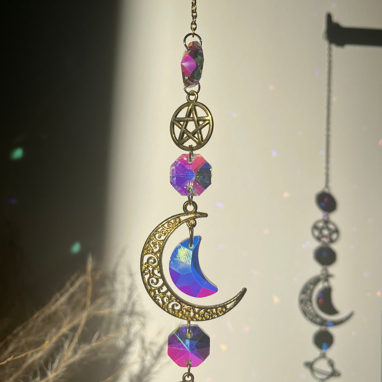 Decorative Suncatcherwith celestial elements on a dark background