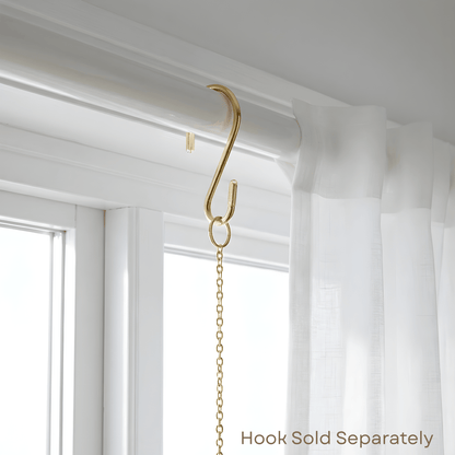 Gold curtain hook attached to a white curtain with text 'Hook Sold Separately' at the bottom.