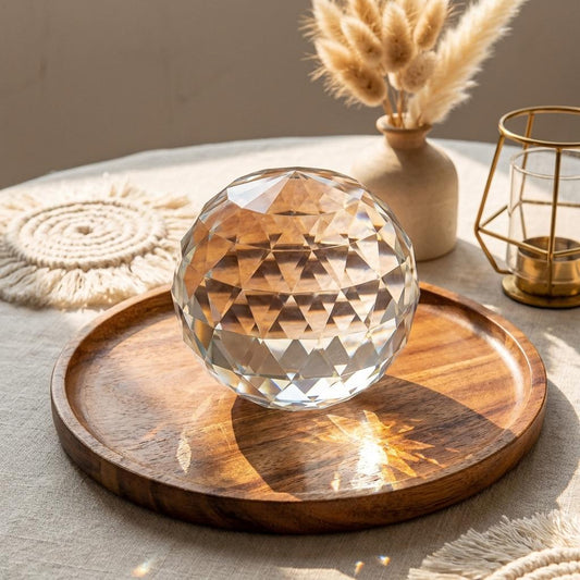 Crystal ball on a wooden tray with decorative elements in the background