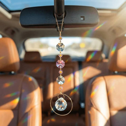 Car interior with a crystal hanging from the rearview mirror
