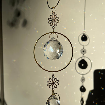 Decorative ceiling light fixture with crystal elements on a white background