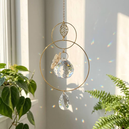 Decorative hanging crystal with gold accents on a neutral background