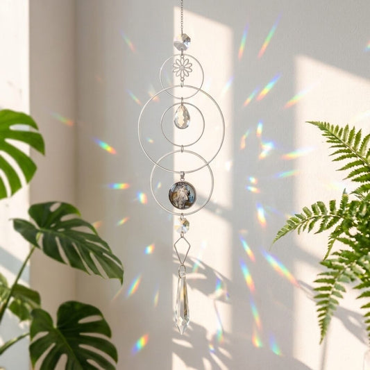 Decorative hanging crystal with rainbow effect on a light background