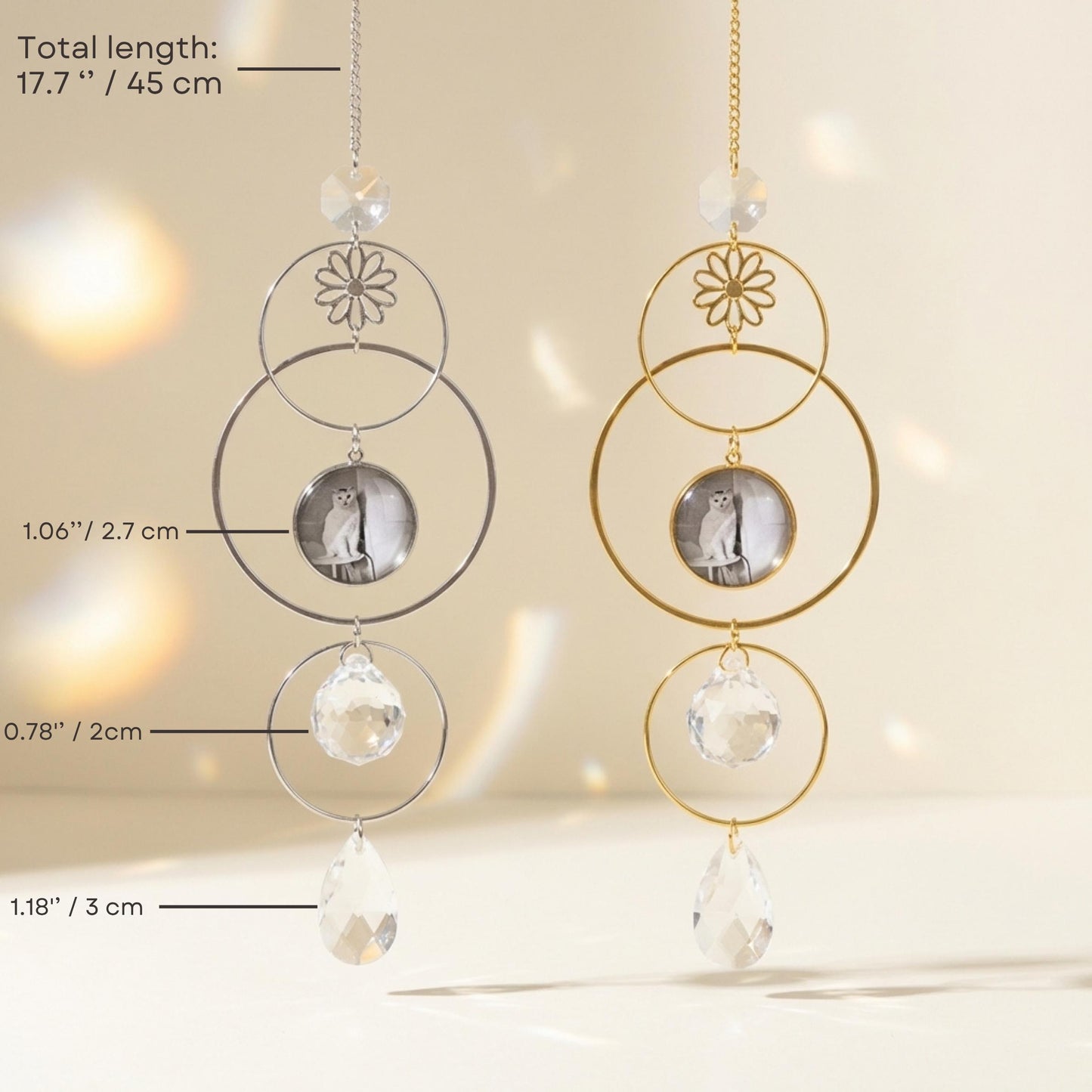 Two circular hanging decorations with crystal elements on a neutral background