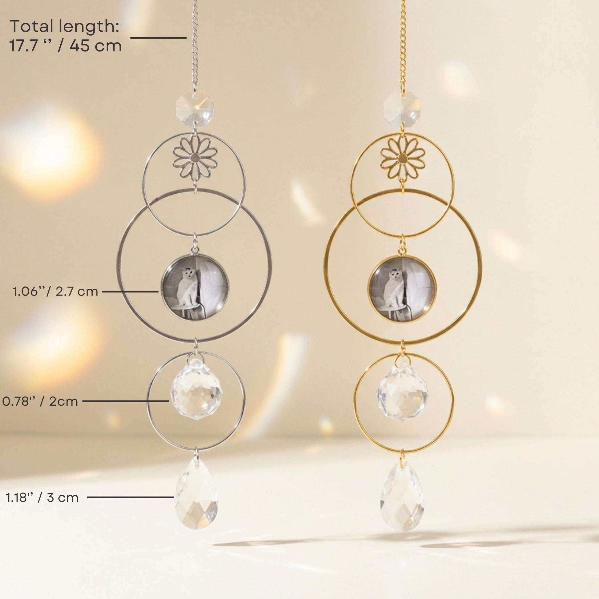 Two circular hanging decorations with crystal elements on a neutral background