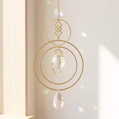 Decorative hanging crystal with gold frame in a bright room
