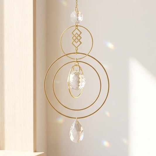 Decorative hanging crystal with gold frame in a bright room