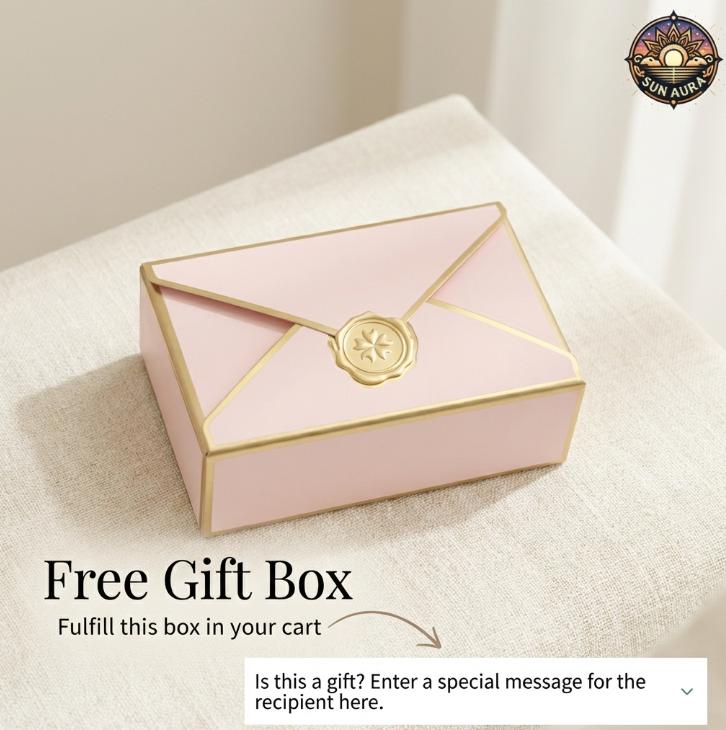 Pink gift box with gold accents on a beige surface, featuring a brand logo in the corner.