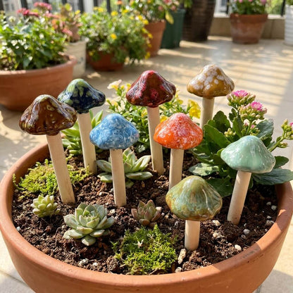 Colorful mushroom-shaped planters in a pot with small plants