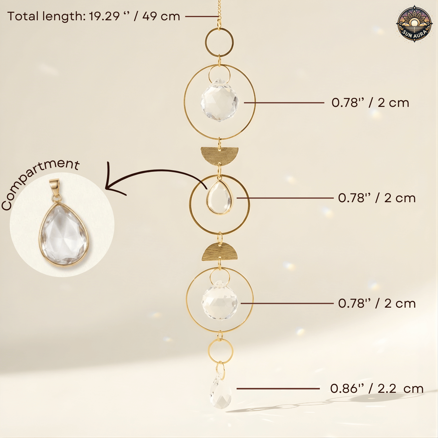 Gold-toned suncatcher with clear faceted glass and teardrop glass elements, shown with measurement callouts and a inset showing the pendant compartment.