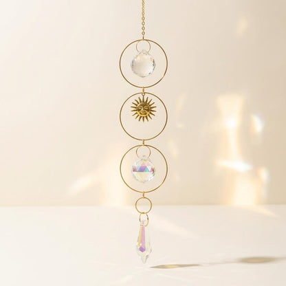 Decorative hanging crystal with gold frame on a soft beige background