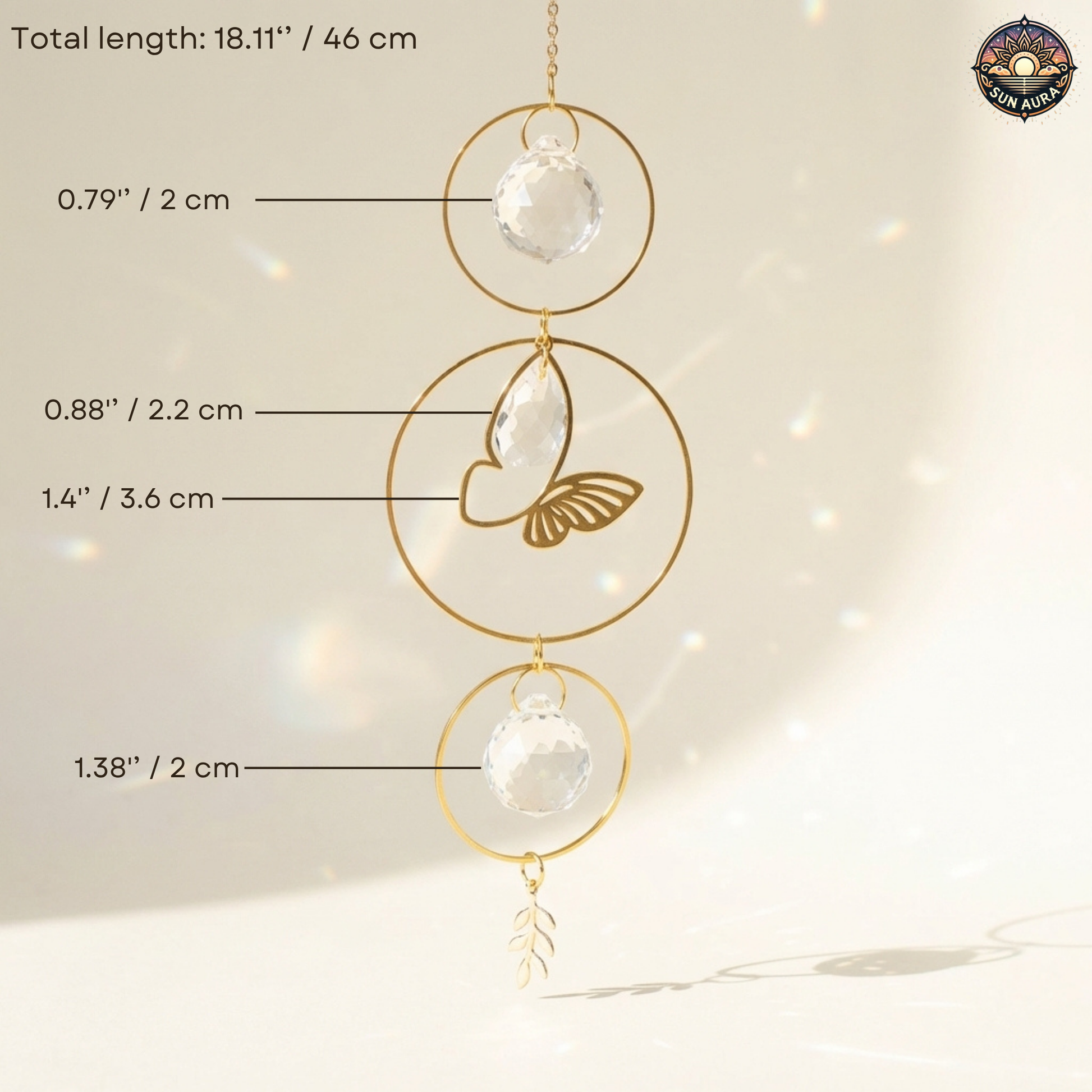 Decorative hanging with glass spheres and gold circular frames, labeled with dimensions.