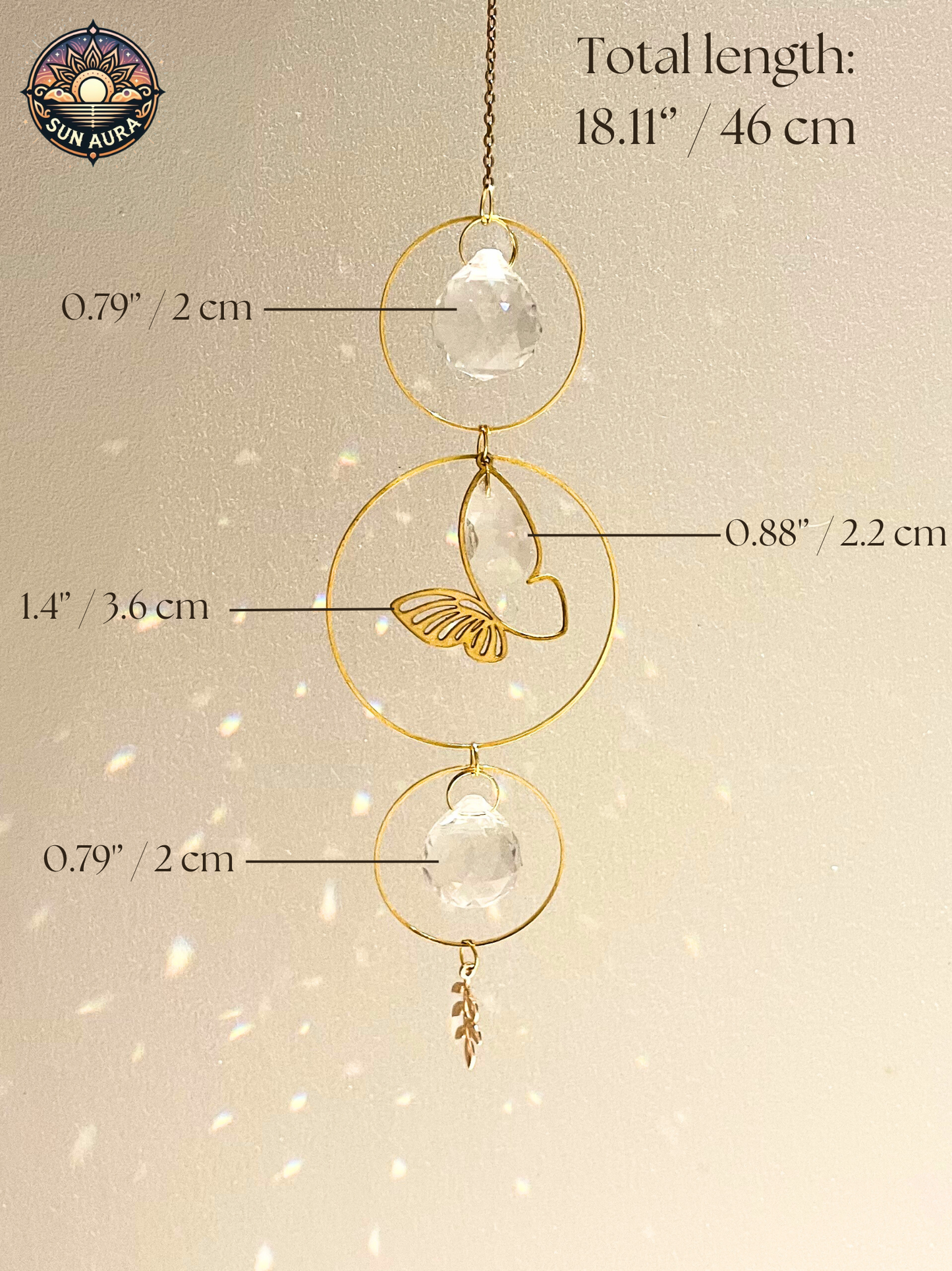 Gold hanging decorative item with measurements on a beige background