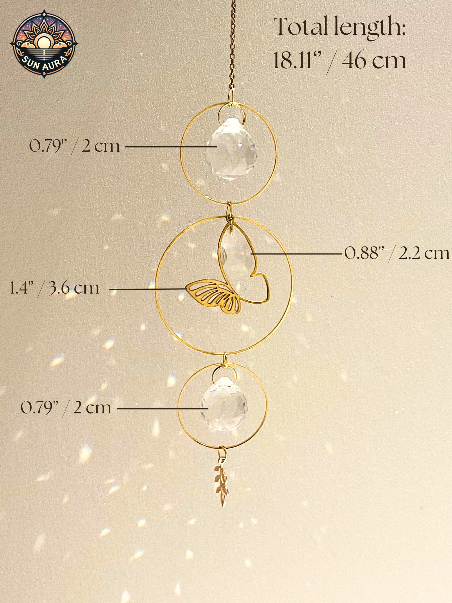 Gold hanging decorative item with measurements on a beige background