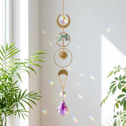 Decorative hanging crystal with celestial design in a home setting
