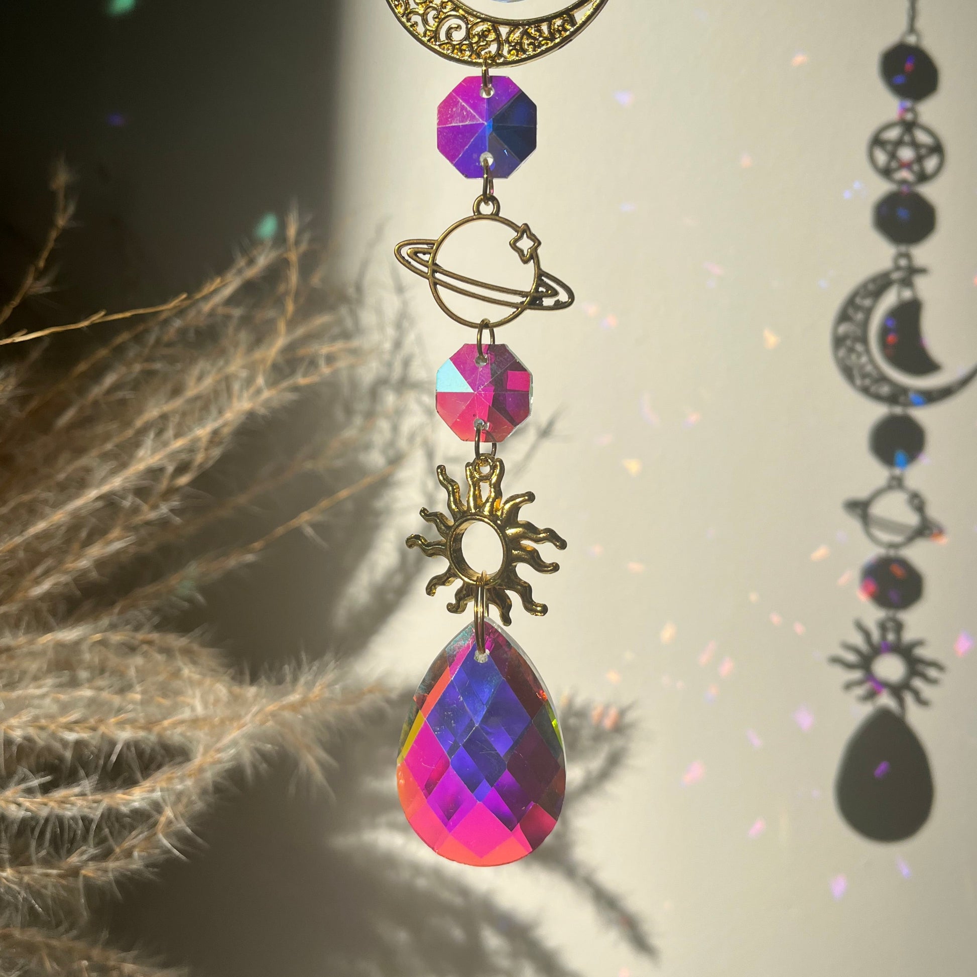 Decorative Suncatcher with celestial elements against a natural background