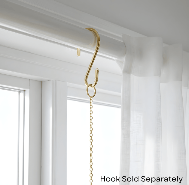 Gold geometric prism suncatcher reflecting rainbow light, artisan boho gift for moms who love home décor.