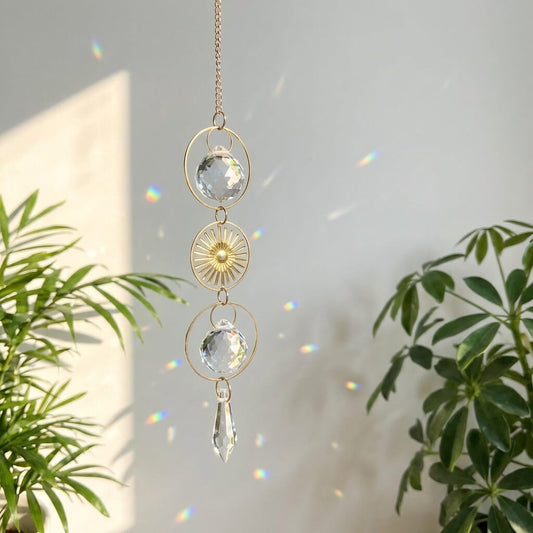 Decorative hanging crystal with plants in the background