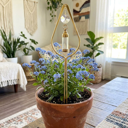 Potted plant with a decorative gold stand in a home setting