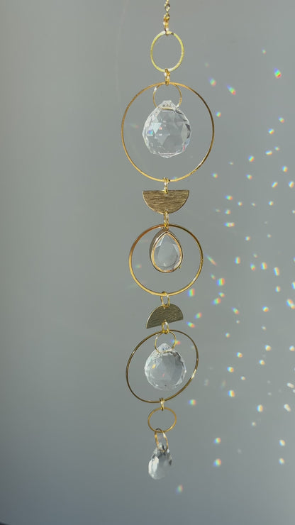 Memorial keepsake suncatcher casting colorful light on a wall, symbolizing peaceful remembrance.