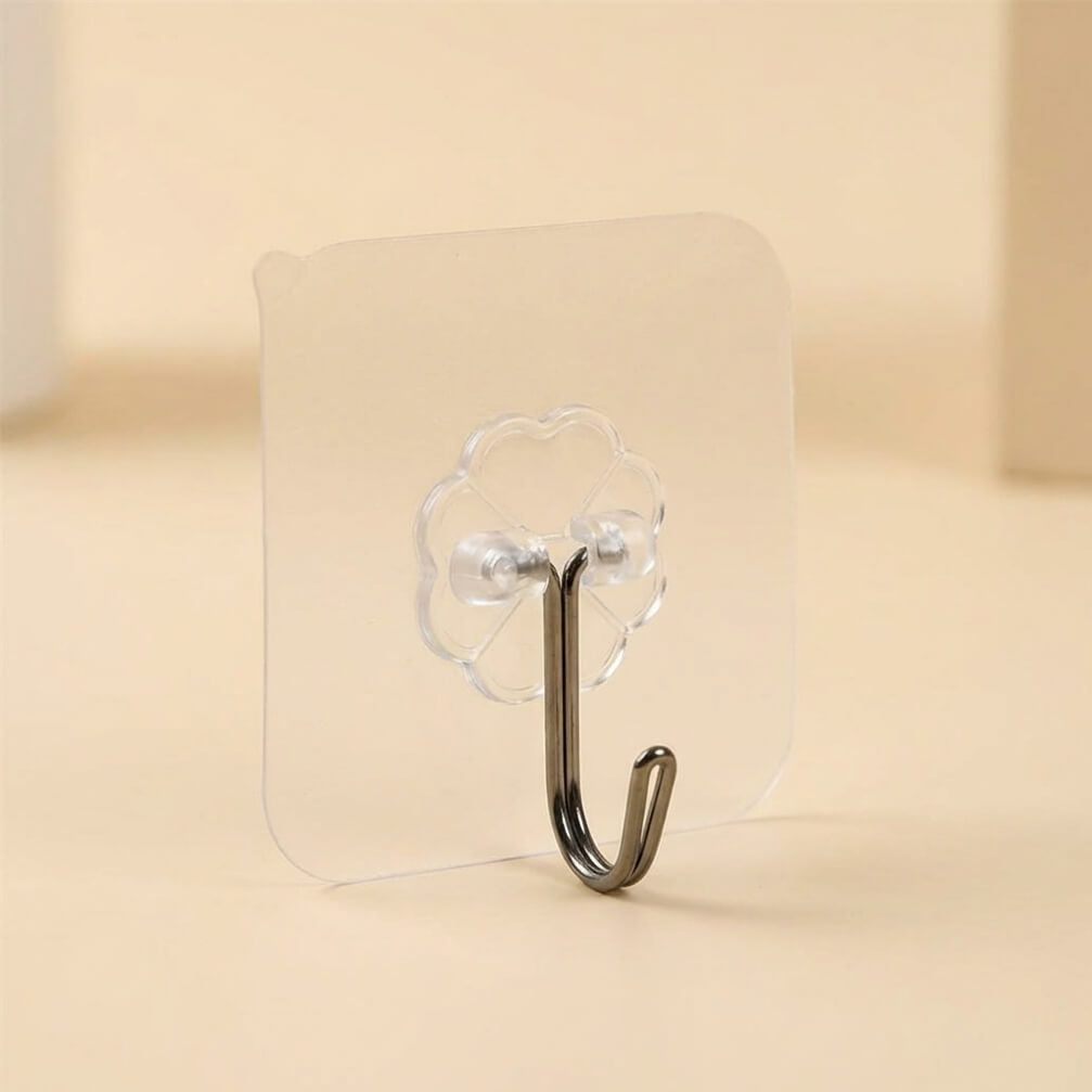 Clear adhesive hook on a beige background
